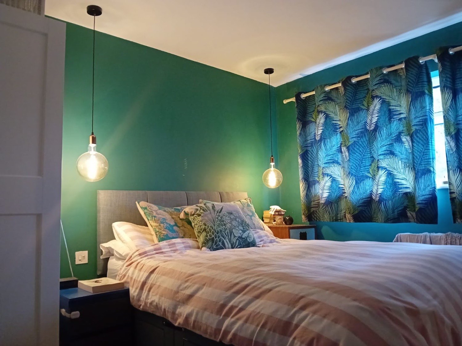 Feature globe pendants either side of a bed
